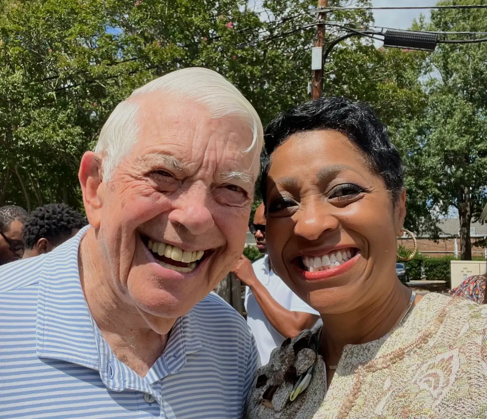 Hugh McColl standing with Southern Lion CEO Sonja Nichols at the marketplace.